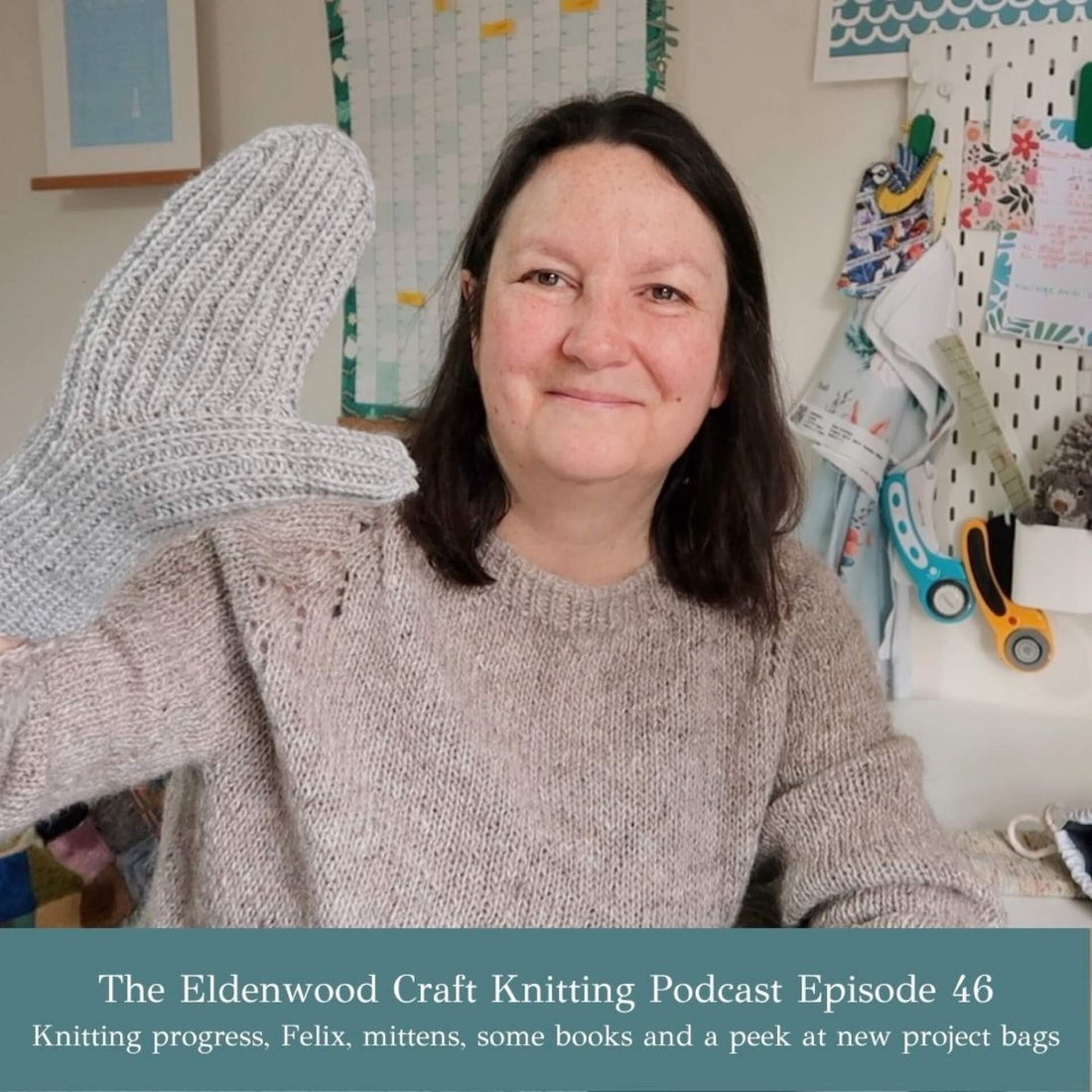 Emma shows off a handknit mitten whilst recording the latest episode of her knitting podcast
