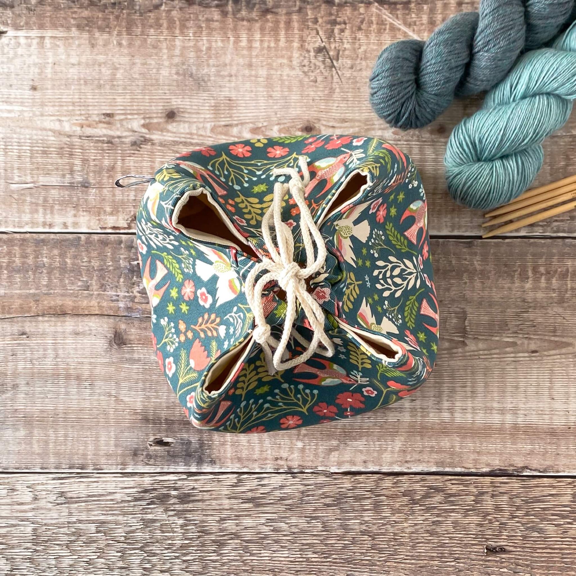 A top down view of a Japanase rice bag style knitting and crochet project bag. 