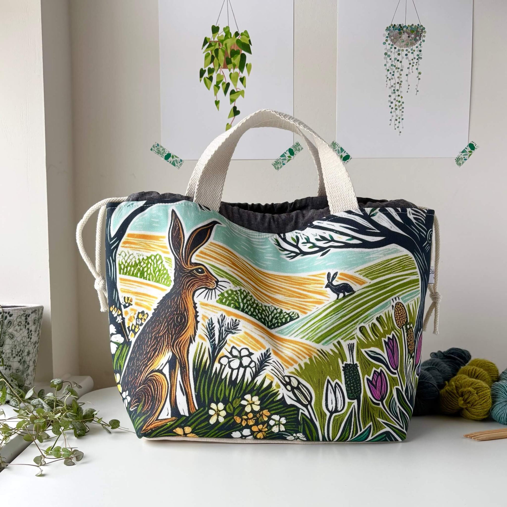 Large project bag with nature-themed design featuring a hare and landscape on a white surface.