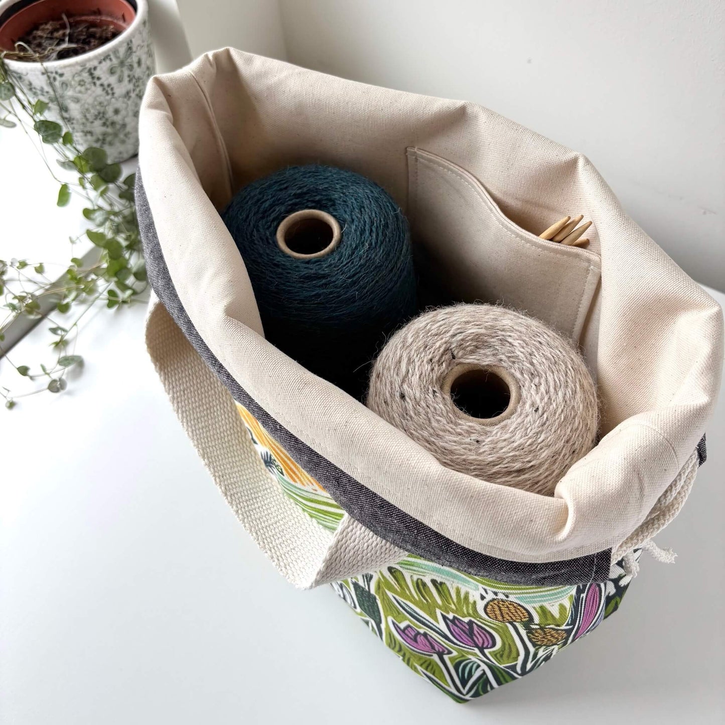 Fabric storage bag with yarn and knitting needles 