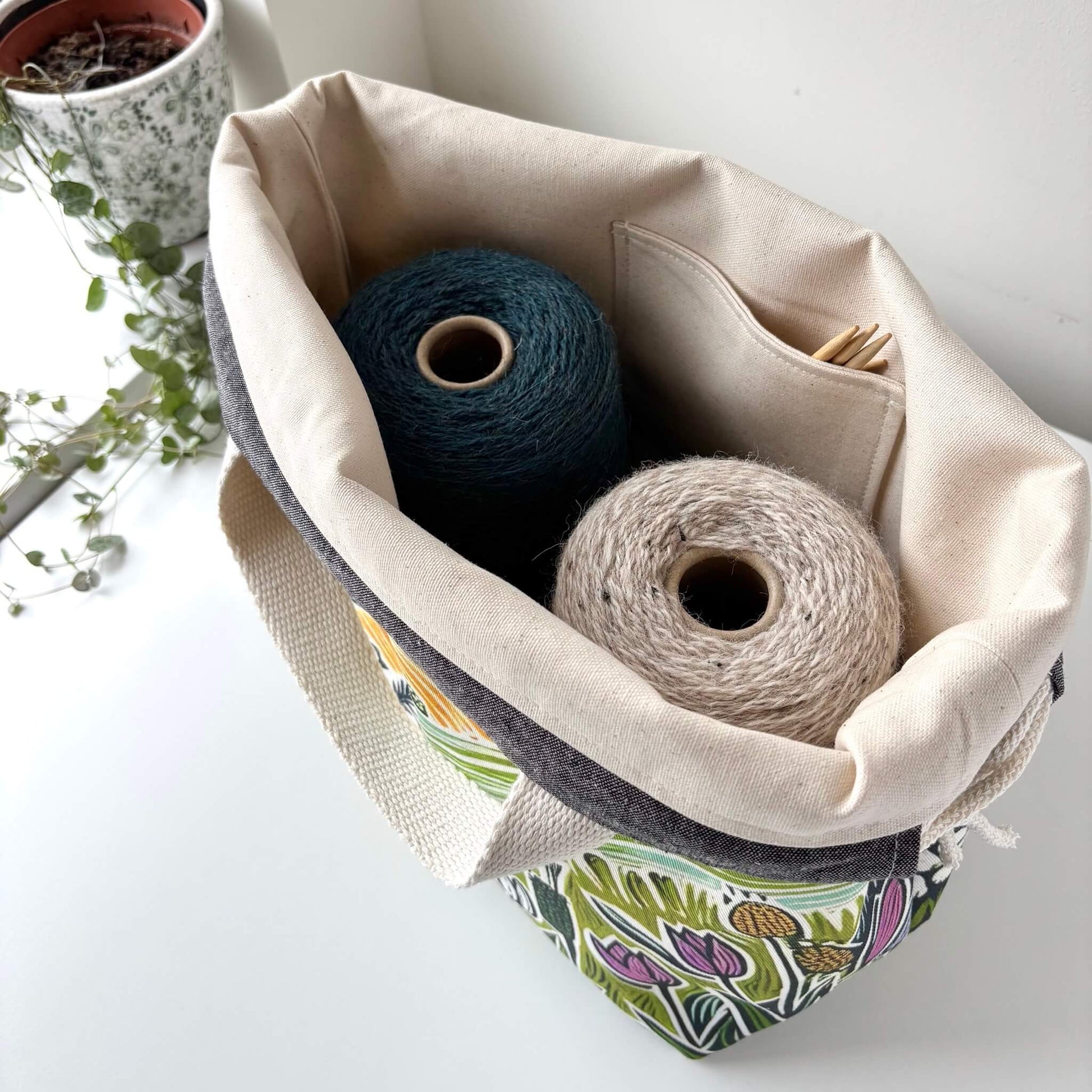 Fabric storage bag with yarn and knitting needles 