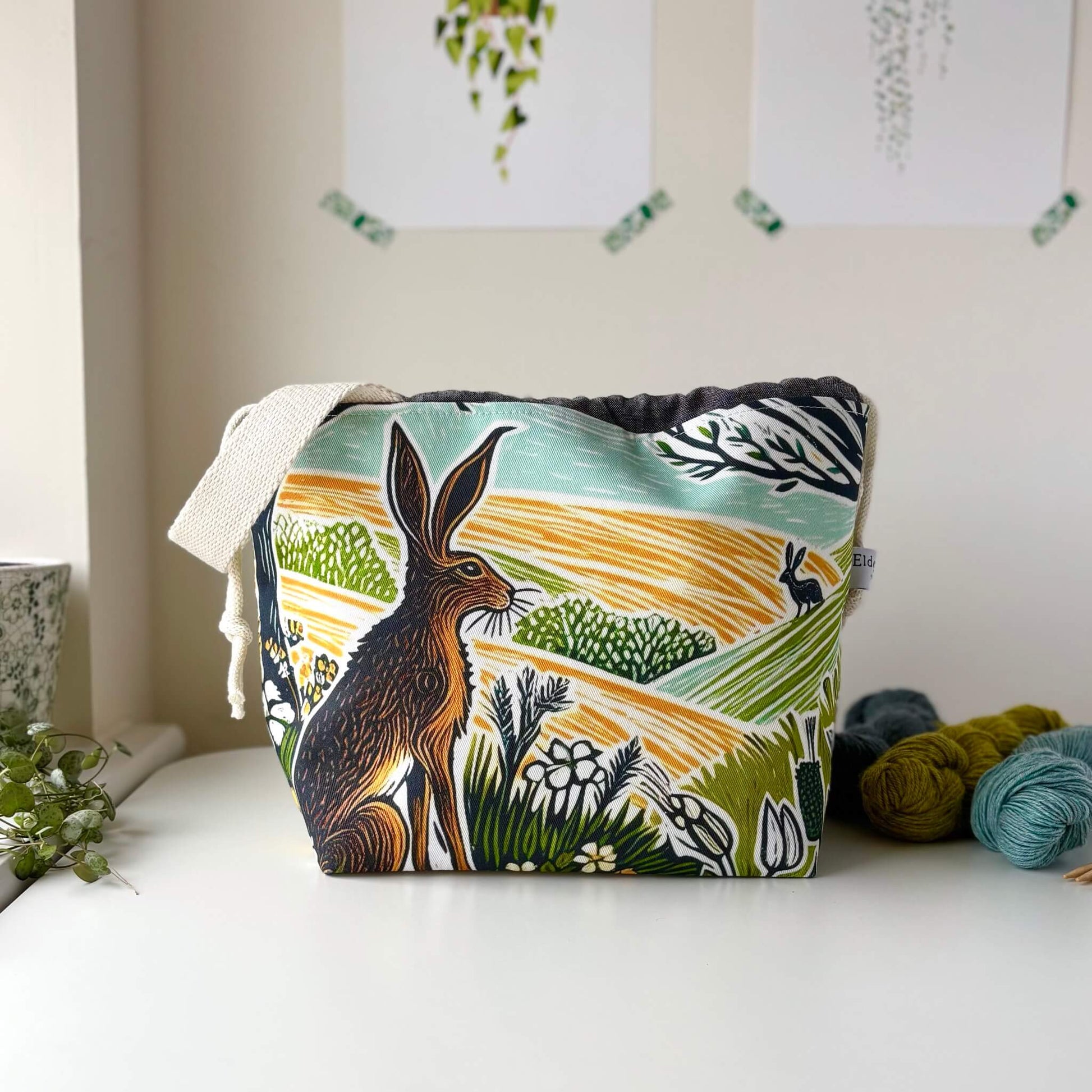 A knitting project bag featuring a spring hare print. Comes with a carry handle and is big enough for projects like shawls and slipovers. 