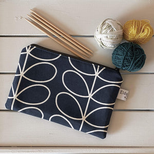A notions pouch for knitting and crochet, handmade by Eldenwood Craft using a classic Orla Kiely fabric